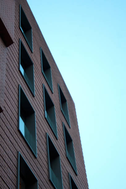 Masonry building facade detail with square windows pattern