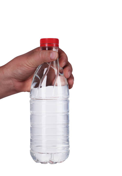 istock a bottle of water held in your hand 1161419319