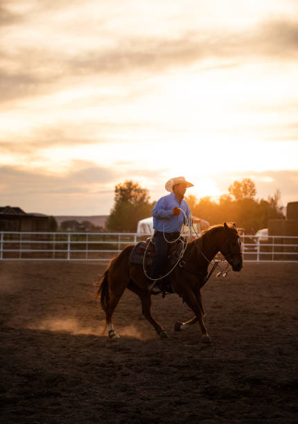 istock Cowboy riding at rodeo arena 1161419374