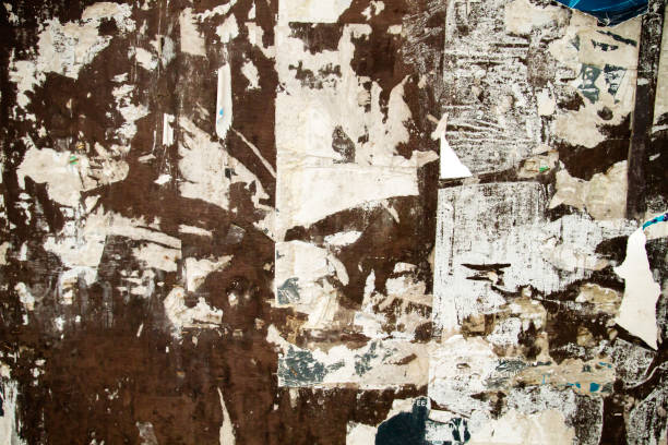 istock OLd grungy wall with remains of paper 1161419626