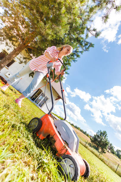 istock Woman mowing green grass 1161420232