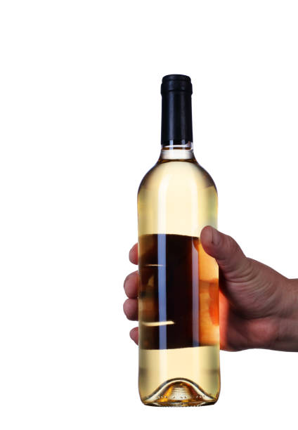 a bottle of wine held in a hand