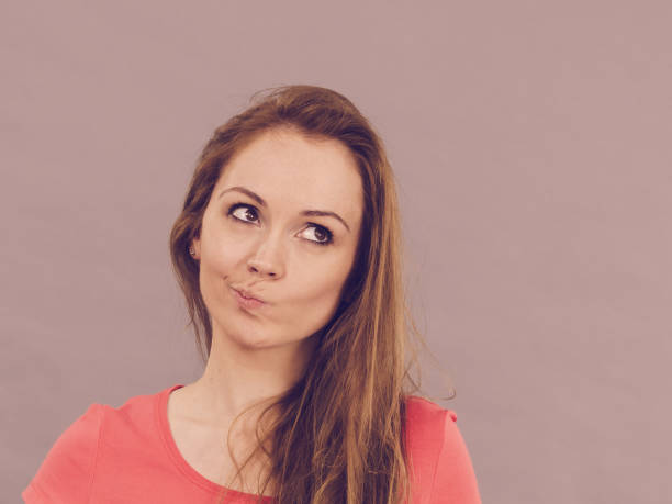 istock Doubtful woman having displeased expression 1161420265