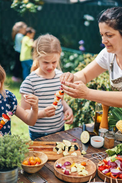 istock Preparing Vegetarian Kebab with Grilled Cheese and Vegetables Outside 1161421136