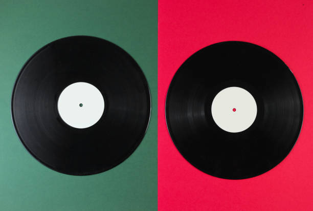 istock Two vinyl records on a green-red background. Retro style. Top view. 1161421742