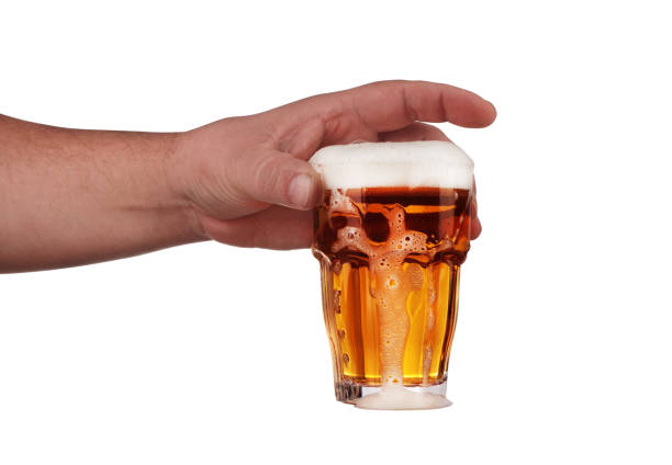 istock a glass of beer held in your hand 1161422052