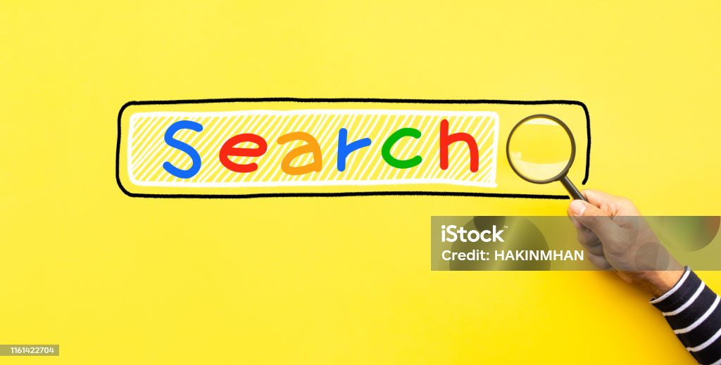 Searching concepts with male hand using magnifying glass with Search text icon on yellow space background Searching concepts with male hand using magnifying glass with Search text icon on yellow space background.business performance Search Engine Stock Photo