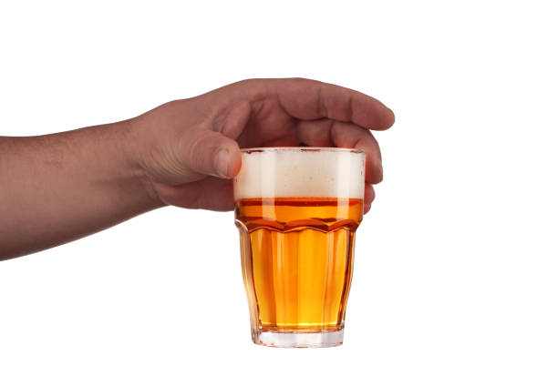 istock a glass of beer held in your hand 1161422722