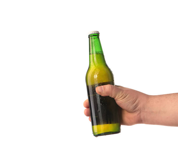 istock a bottle of beer kept in a hand 1161422934