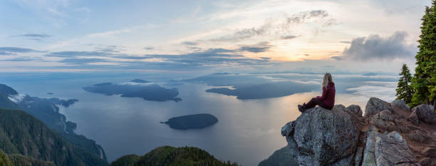 istock Adventurous Hiker on top of a Mountain during Sunset 1161425029