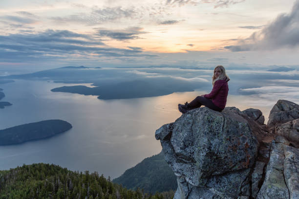 istock Adventurous Hiker on top of a Mountain during Sunset 1161425047