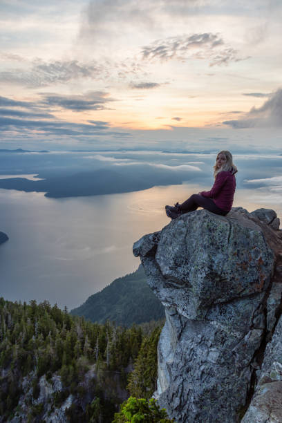 istock Adventurous Hiker on top of a Mountain during Sunset 1161425570