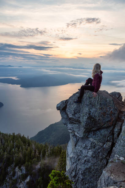 istock Adventurous Hiker on top of a Mountain during Sunset 1161425586