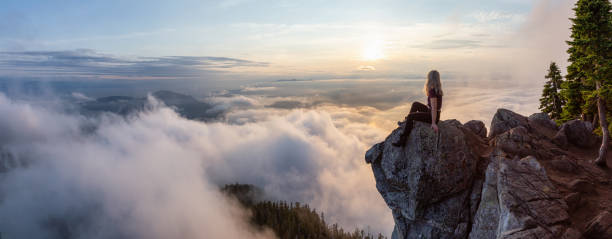 istock Girl on top of a Mountain 1161425867