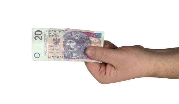 istock twenty Polish zlotys in hand 1161427829