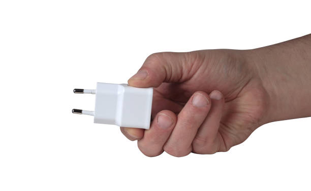 istock charger for phones held in a hand 1161427929