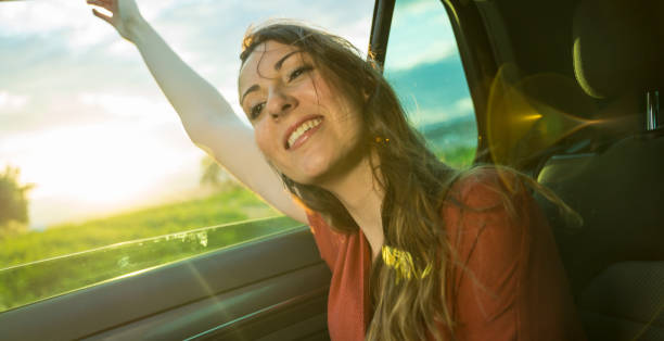 istock Woman feeling fresh spring air in a car. 1161428340