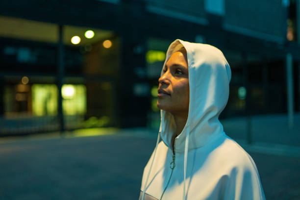istock Determined young woman wearing a hooded sweater 1161429061
