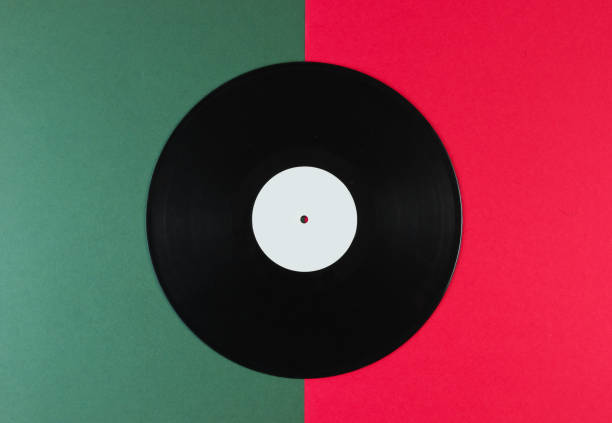 istock Vinyl record on a green-red background. Retro style. Top view. 1161429169