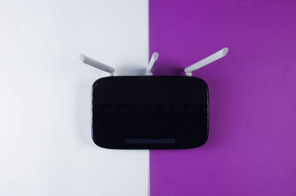 istock Tried Wi fi router on gray-purple background. Top view 1161429232
