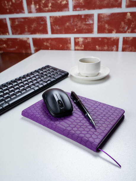 office table desk. workspace with note book, keyboard, office supplies and coffee cup on white background. - spiral notebook audio imagens e fotografias de stock