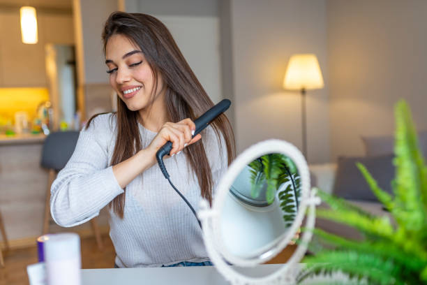 istock Woman combing hair. 1161430546