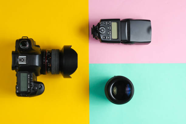 istock Camera, flash, lens on a pastel background. Equipment photographer. Top view. Minimalism 1161430712