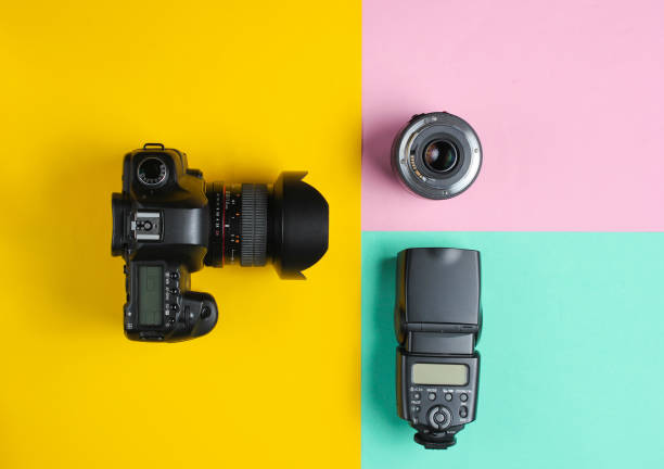istock Camera, flash, lens on a pastel background. Equipment photographer. Top view. Minimalism 1161430718