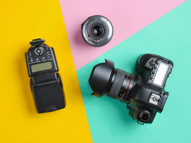 istock Camera, flash, lens on a pastel background. Equipment photographer. Top view. Minimalism 1161430720