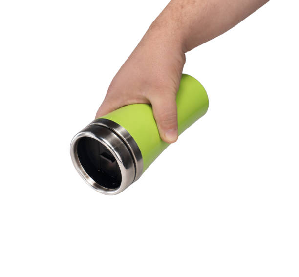 istock thermos mug in a hand on a white background 1161433811