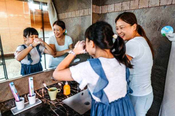 istock Mother with her daughter making soap bubbles 1161433917