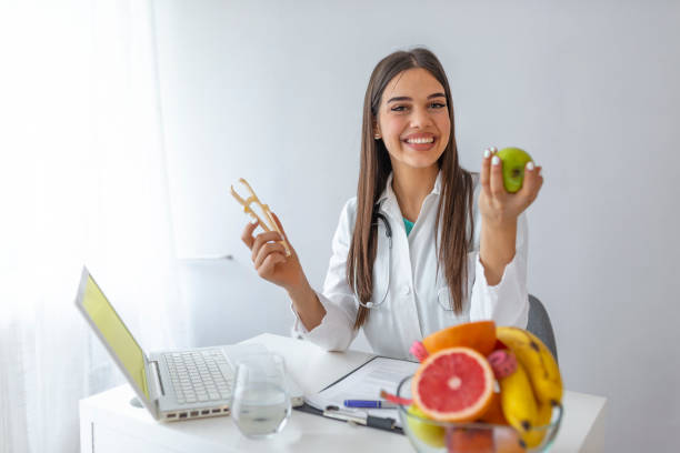 istock Doctor or nutritionist hold an apple. 1161434019