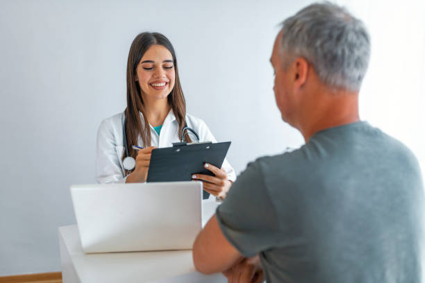 istock Doctor with patient in medical office. 1161434682