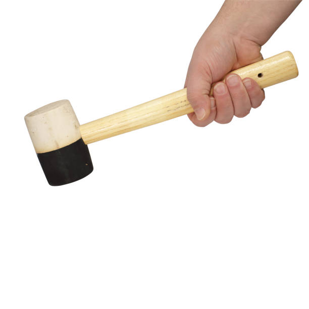 istock rubber hammer in a hand on a white background 1161436114