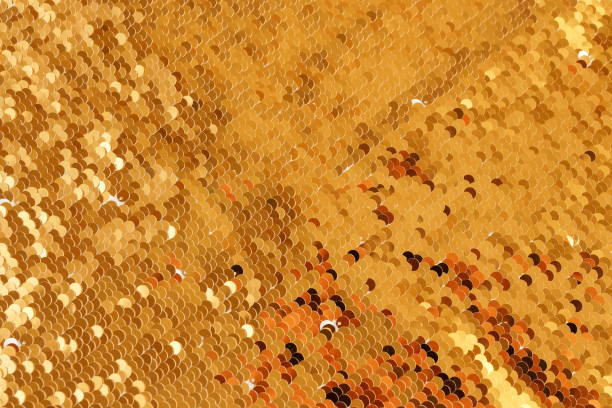 istock Sequins fabric texture, background golden color close-up full frame. Abstract Xmas, festive sparkling background. 1161437388
