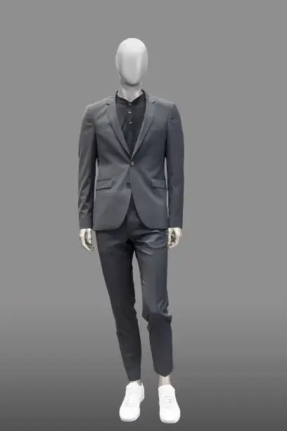 Full-length male mannequin dressed in fashionable suit, isolated. No brand names or copyright objects.