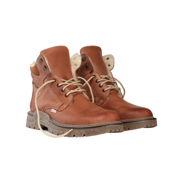 istock brown winter shoes on a white background 1161439212