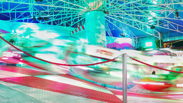 istock Fair attraction in motion with neon lights 1161440876