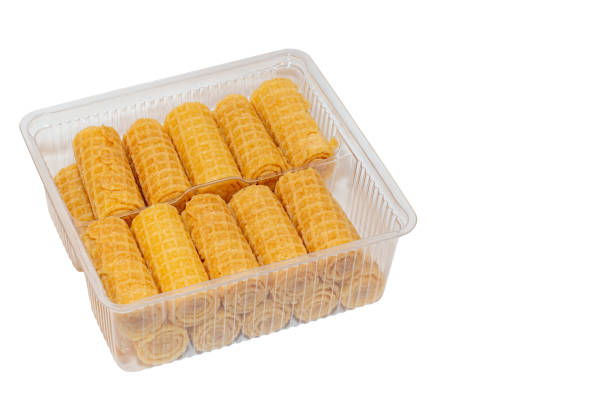 istock Wafer tubes with cream in a plastic container isolated on a white background 1161441768