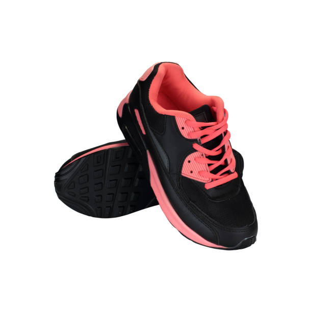 istock black and pink children's shoes on a white background 1161441780