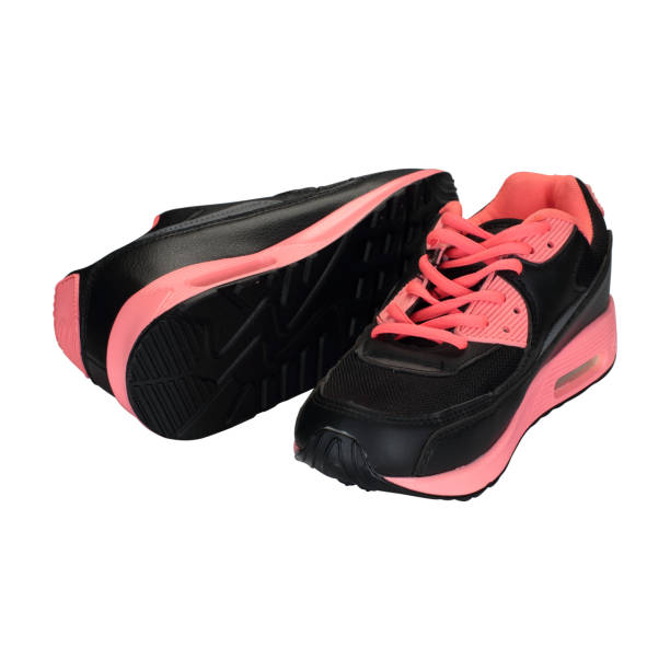 istock black and pink children's shoes on a white background 1161442251