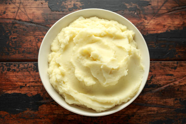 istock Mashed potatoes in white bowl on wooden rustic table. Healthy food 1161444303