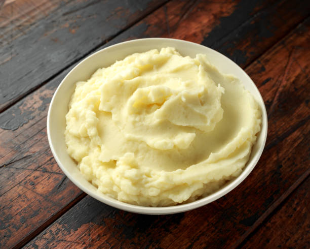 istock Mashed potatoes in white bowl on wooden rustic table. Healthy food 1161444386