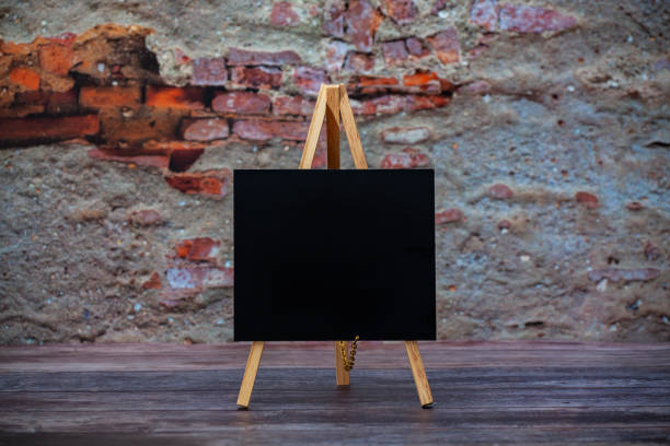 istock Blank Chalkboard on wood floor 1161445789