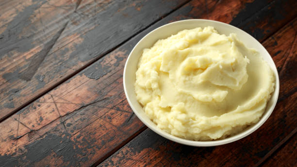 istock Mashed potatoes in white bowl on wooden rustic table. Healthy food 1161446029