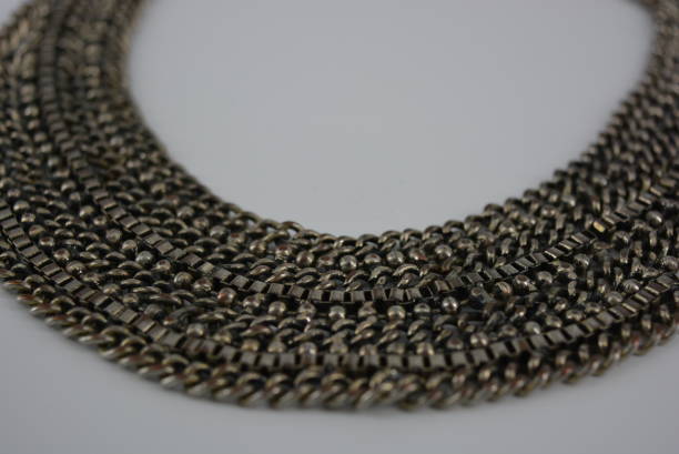 gorgeous gray women's jewelry, a necklace of metal chains and beads. - sesame cooking oil premium organic imagens e fotografias de stock