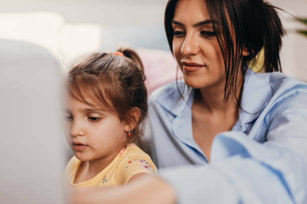 istock Mother working at home with her daughter 1161447010