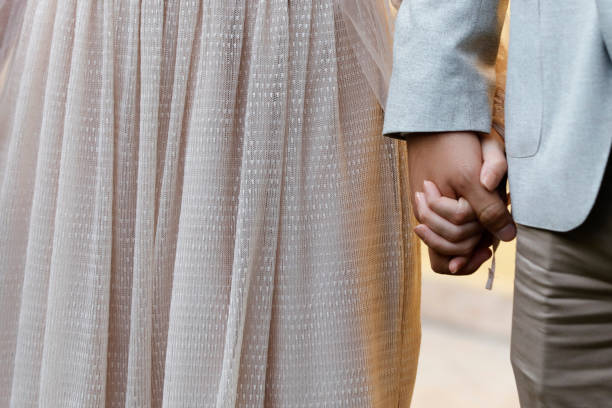 istock Couple holding hands showing that they just got engaged 1161447140