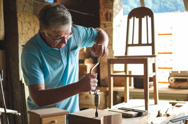 istock Drilling holes in a wooden block 1161448337