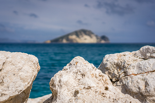 Boulders and rocks on the shore of Keri beach in summer on Zante Island, Greece